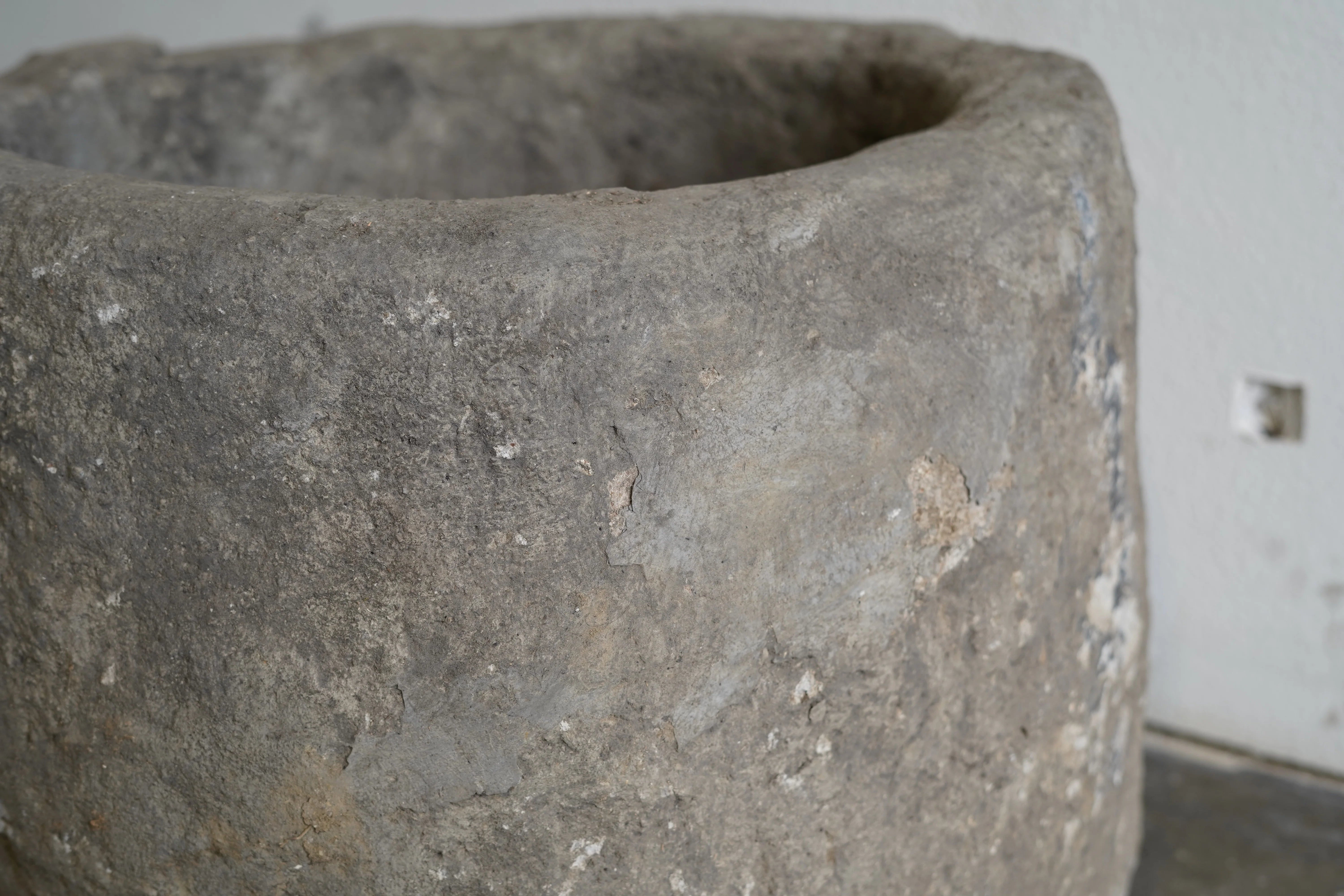 Close up of aging on limestone planter