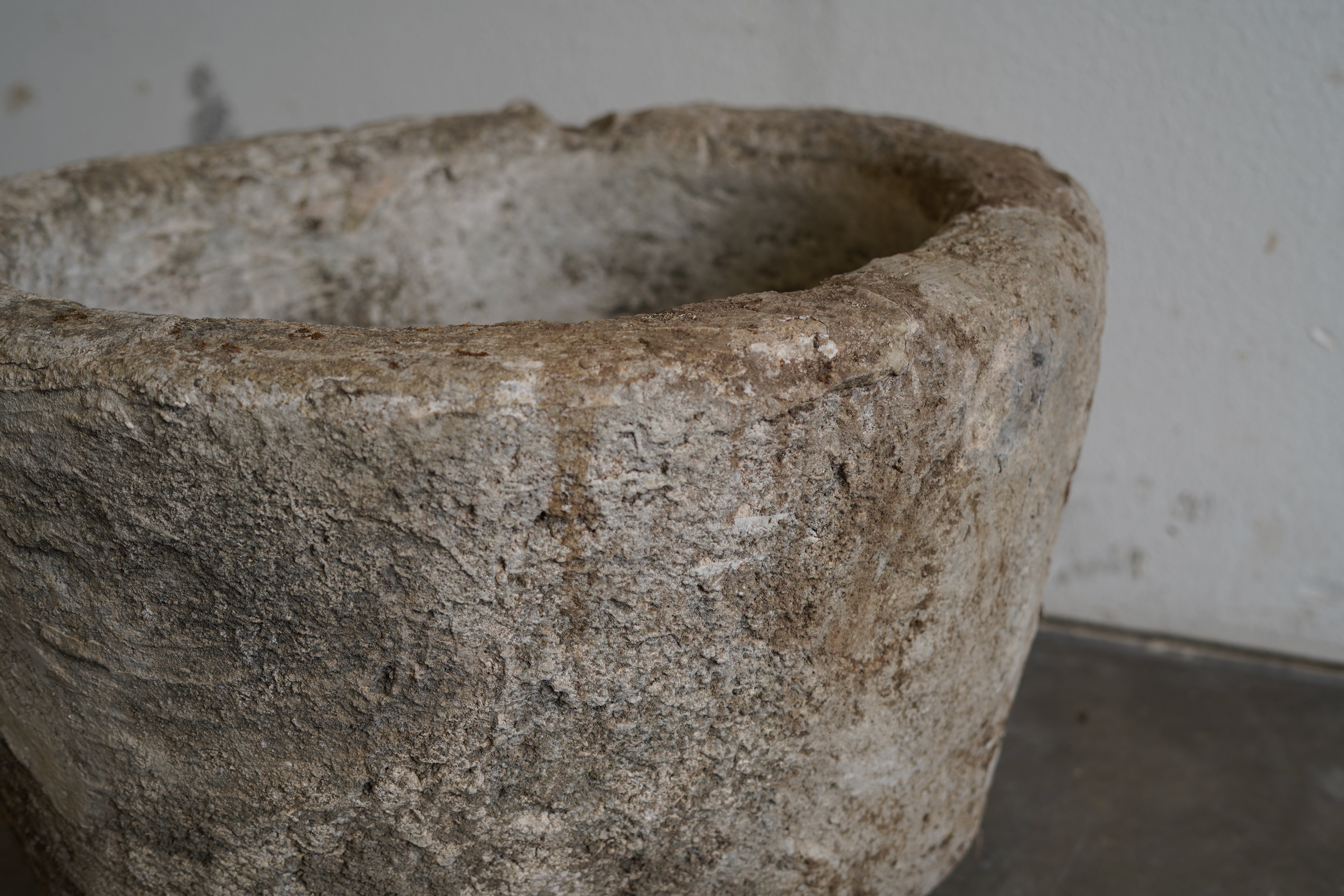 Close up view of Vintage Limestone Vessel. Hand-carved  authentic.

Dimensions: 24" W x 17" H