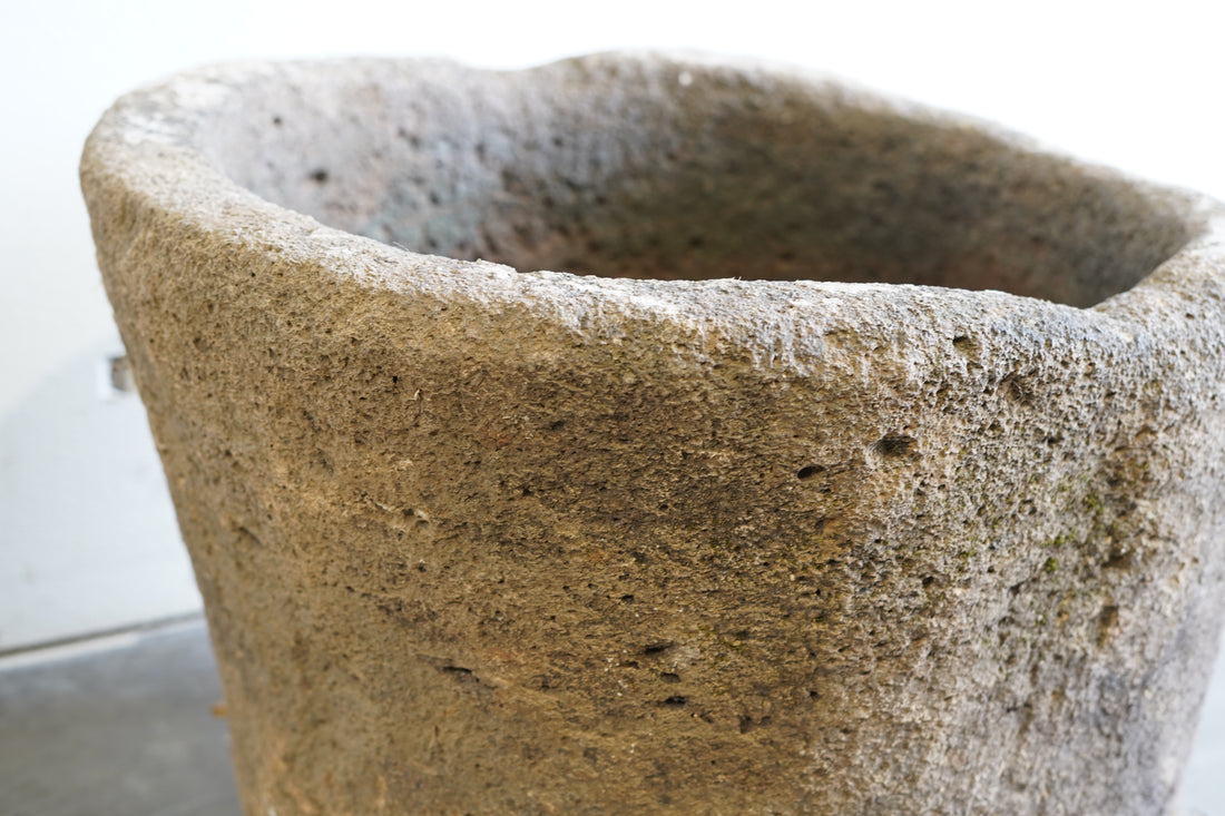 Close up of Vintage Hand-carved authentic limestone planter, fountain or fire pit