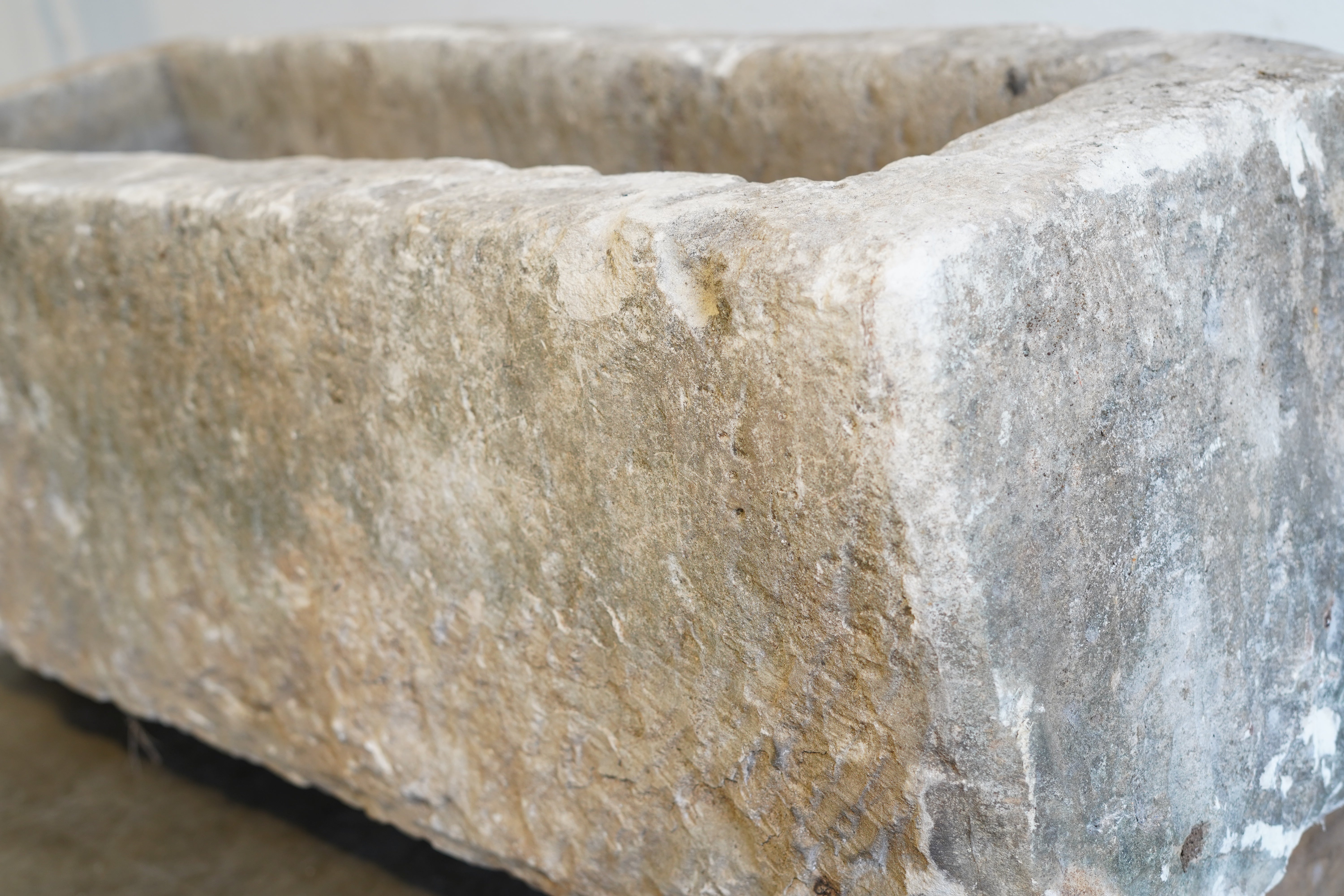 Close up of character on Vintage Limestone - 55" L x 23" W x 16" H