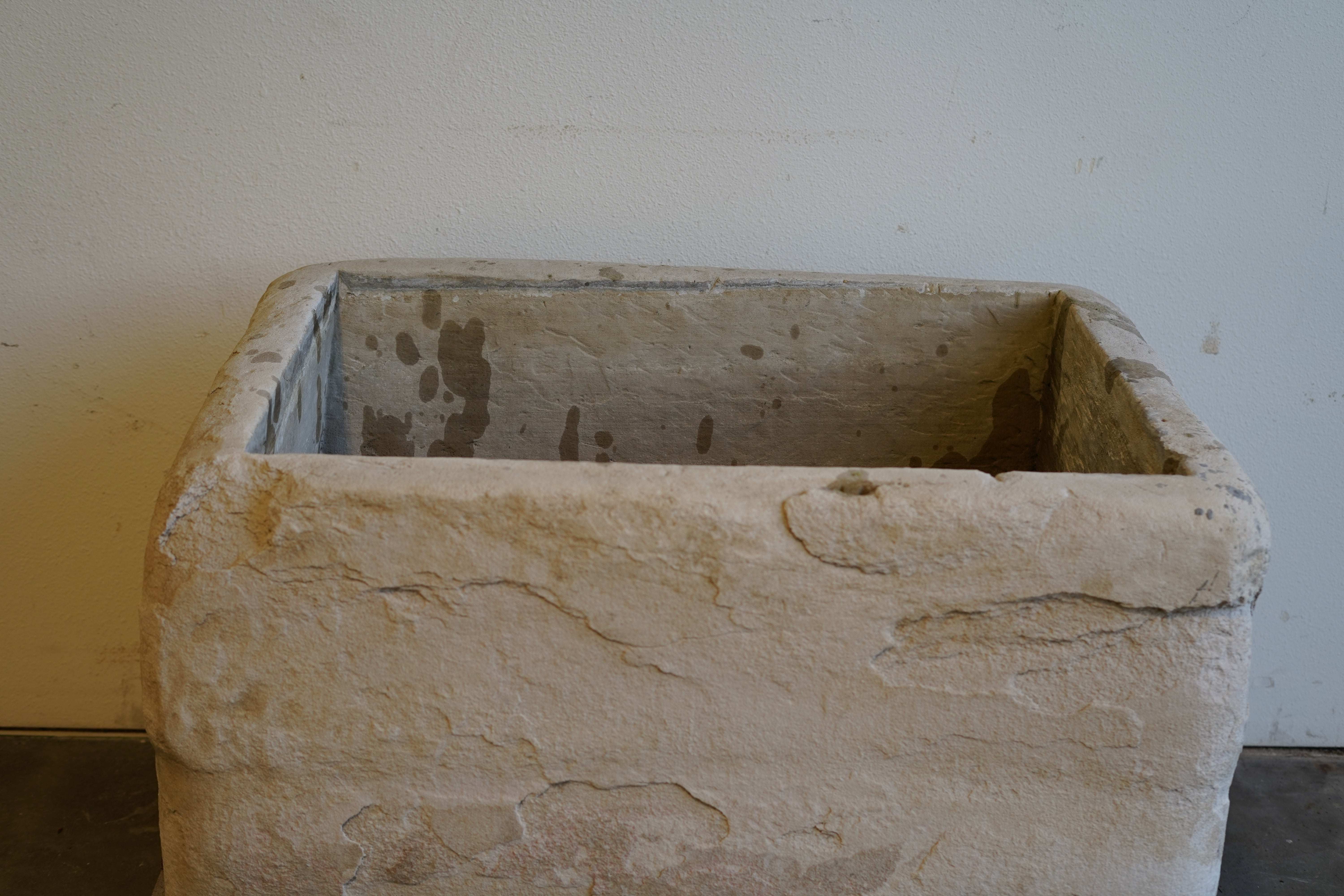 Top-down view of large limestone planter trough, ideal for plants, fountain use or fire pit – rustic outdoor decor.