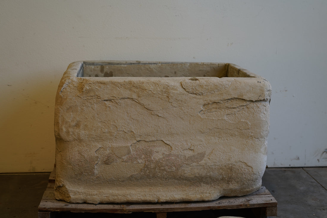 Vintage stone trough planter, showcasing natural wear, perfect for landscape or courtyard styling