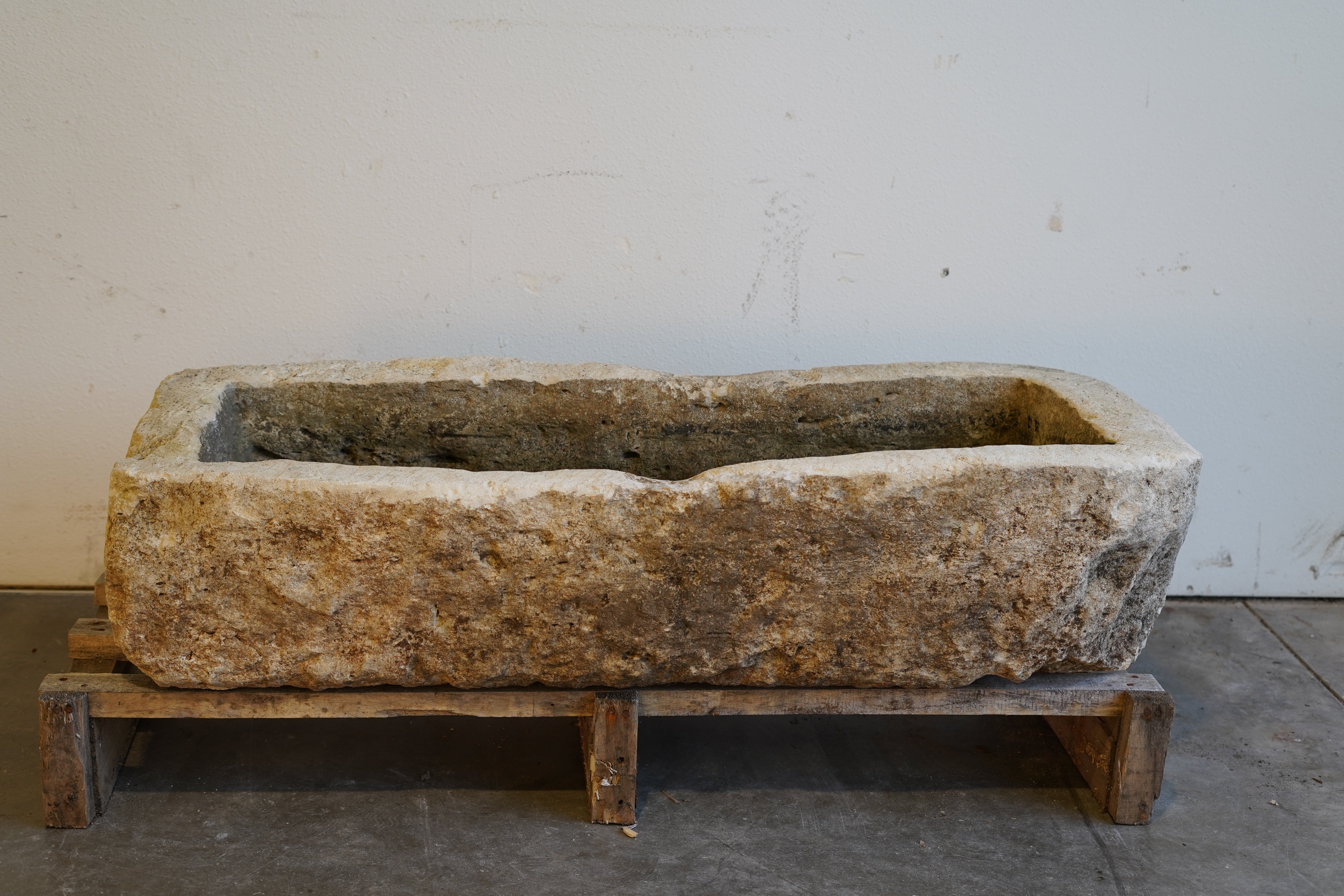 Antique limestone planter, low-profile rectangular shape with weathered texture