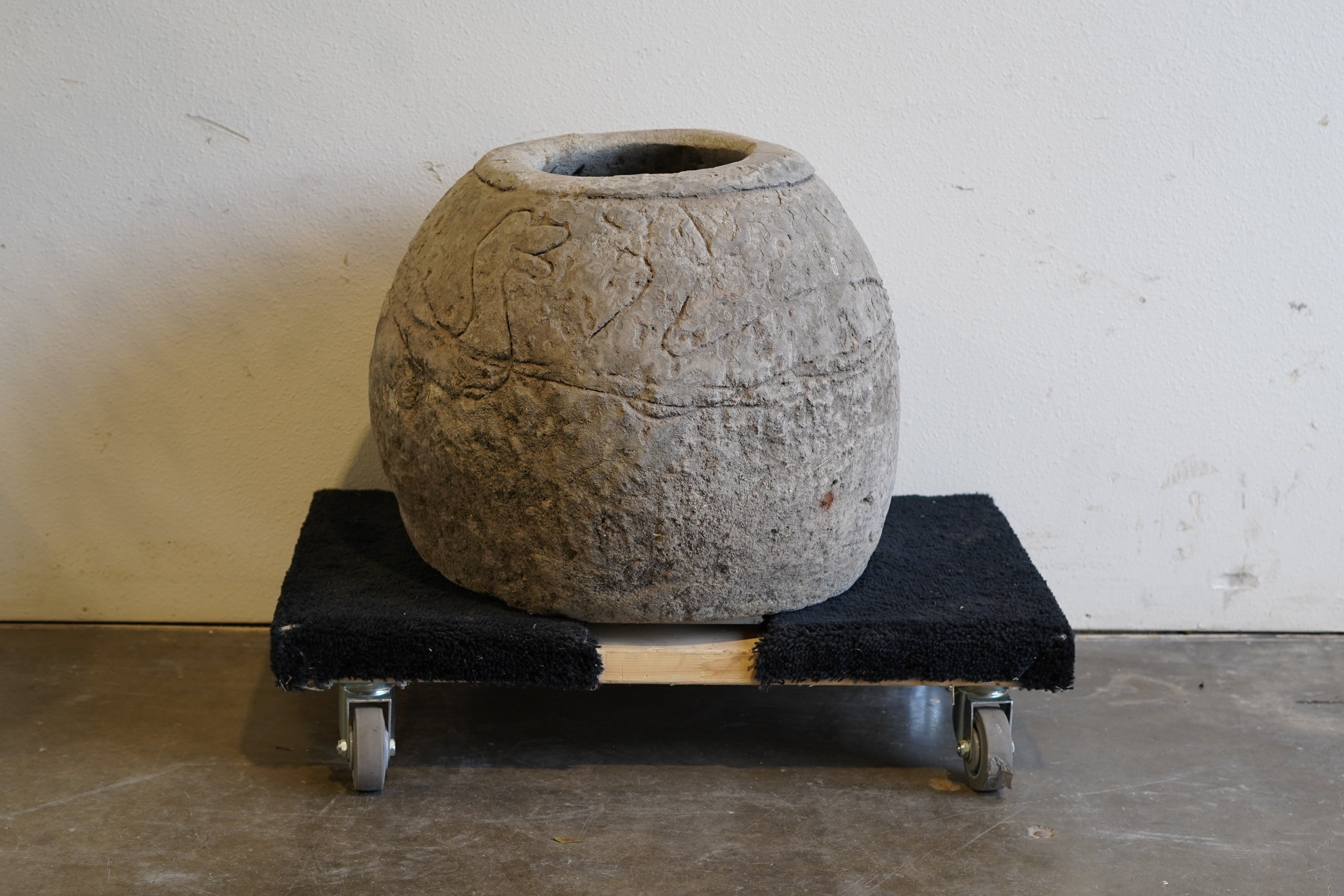 Backside of Vintage Hand-carved limestone planter. 20" H x 20" W