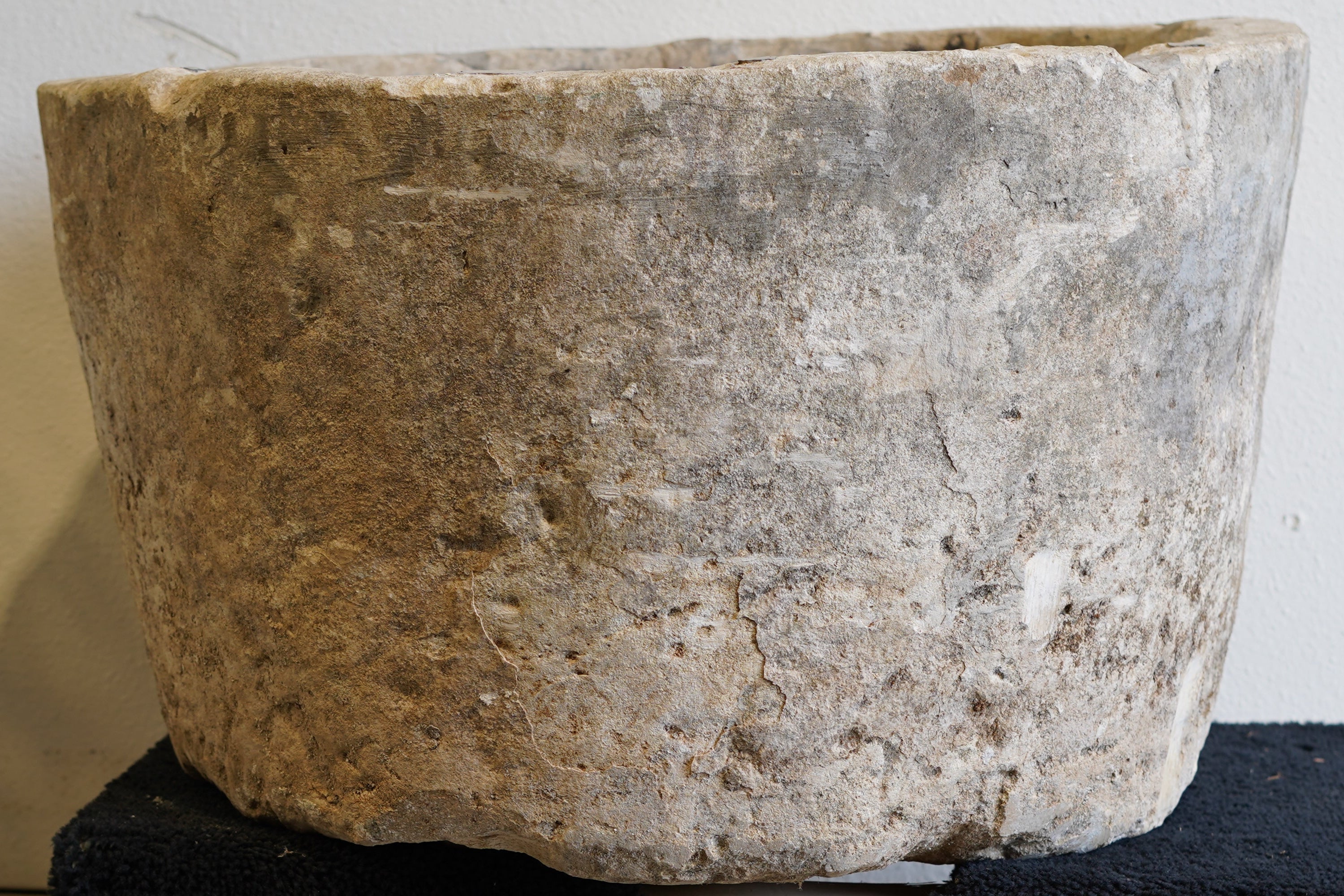 Close up of Vintage Hand-Carved Limestone Round Planter with natural patina with natural aging over decades of wear and use.
