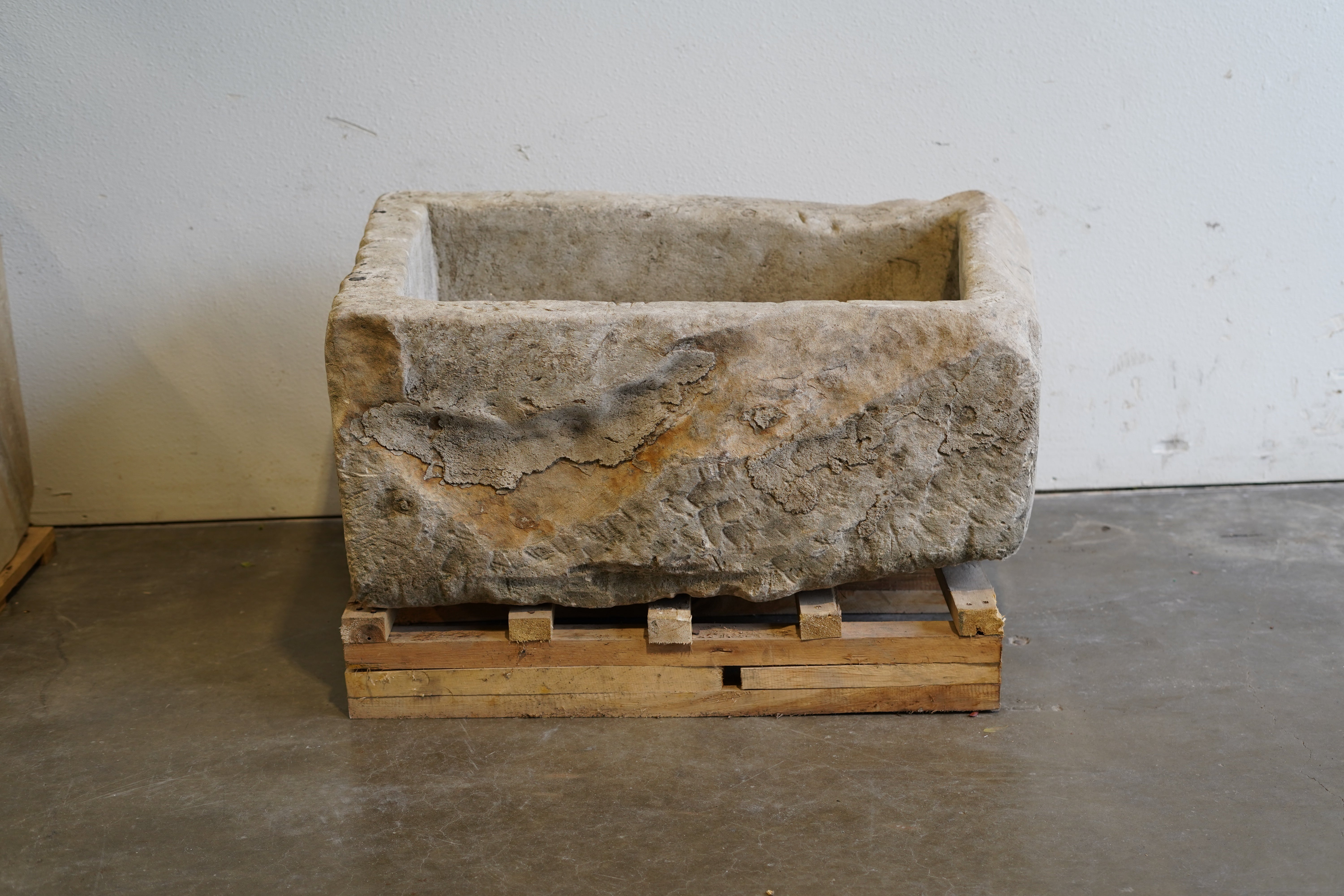 Vintage hand-carved limestone trough. Natural patina, aging, wear and tear.