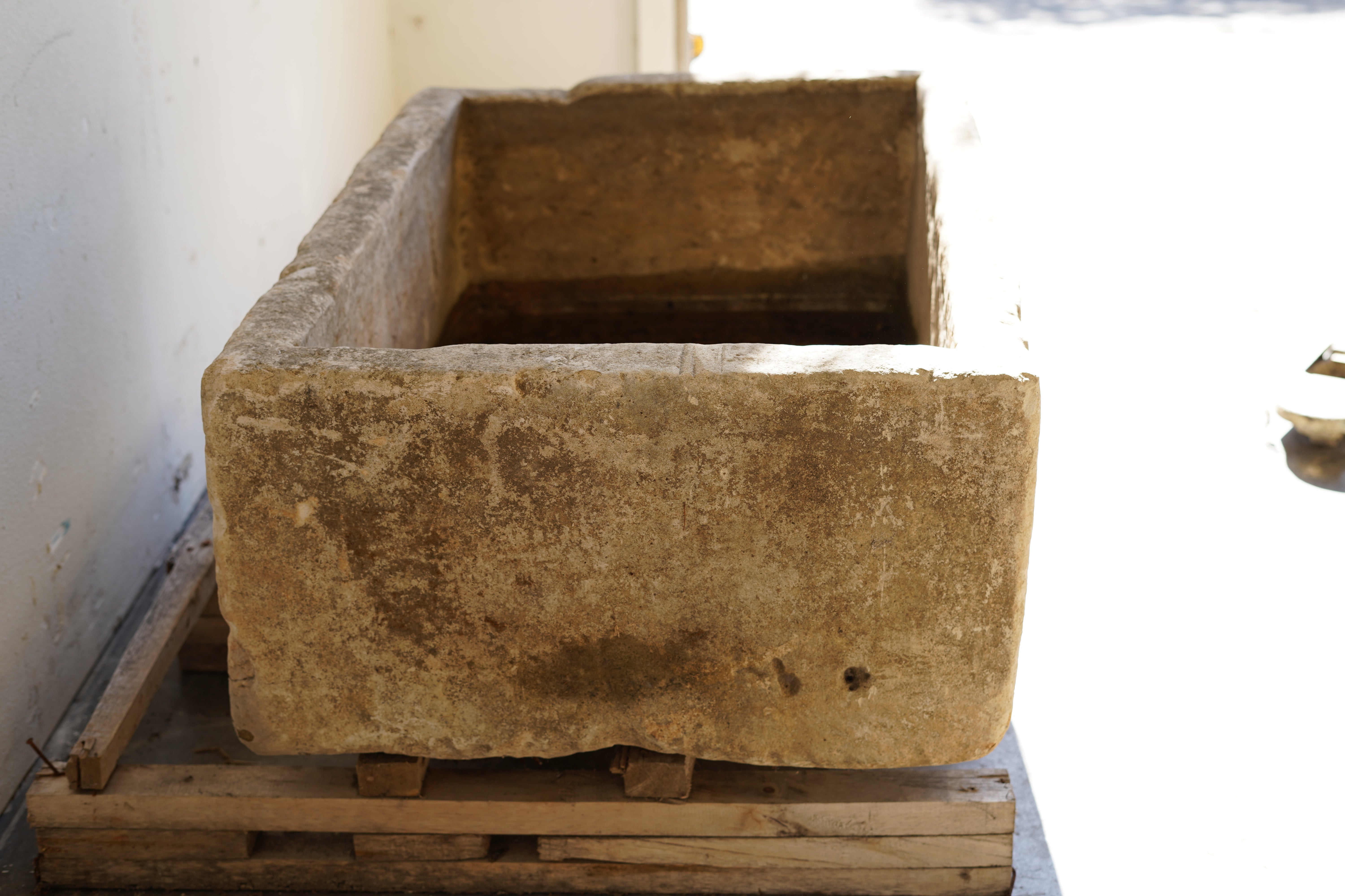 Vintage Limestone Trough in natural lighting. Dimensions: 37.5" L x 25" W x 16.5" H