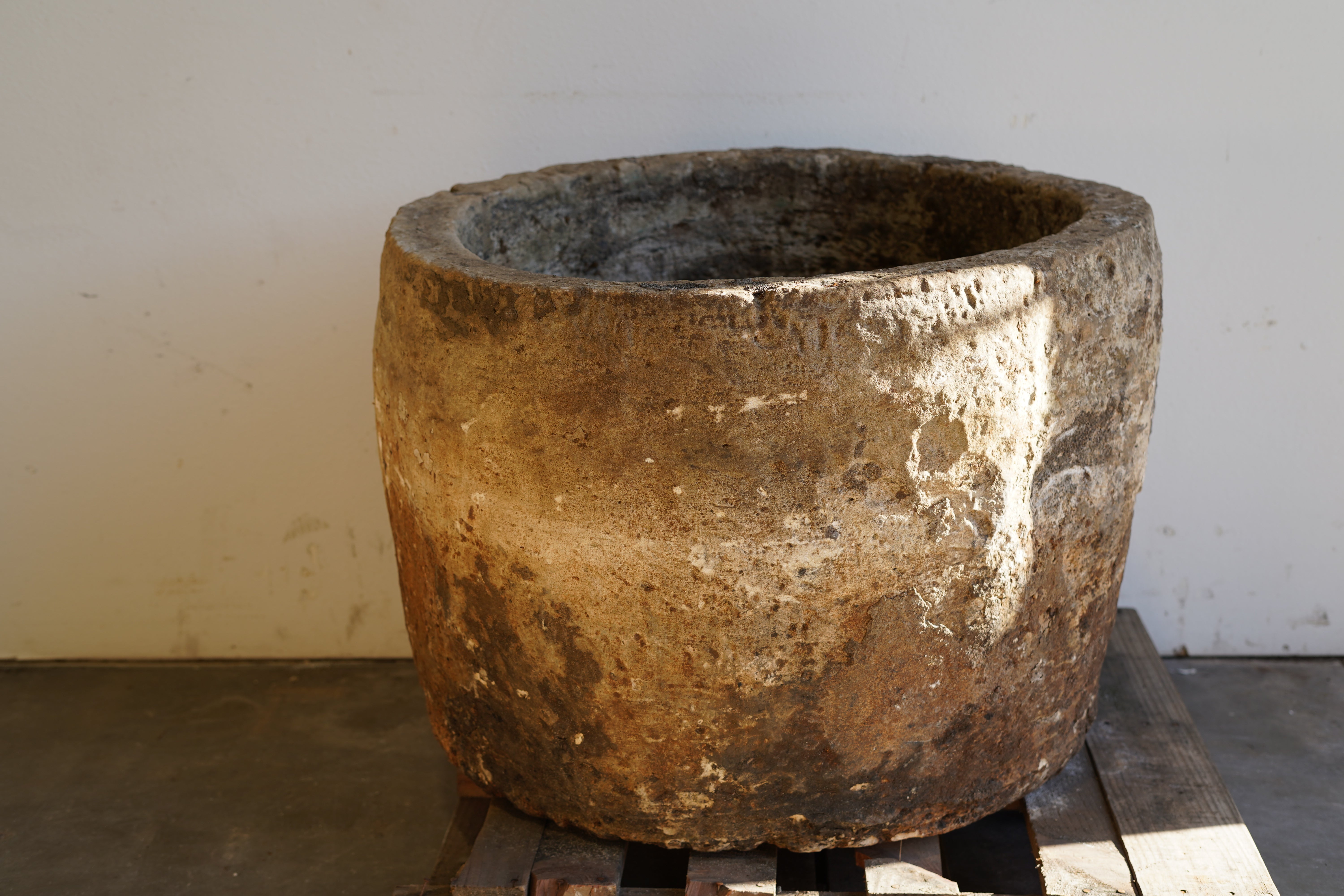 Vintage Authentic Limestone Round Planter 28" H x 34" D sunlight shining in on right side of planter.