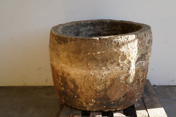 Vintage Authentic Limestone Round Planter 28" H x 34" D sunlight shining in on right side of planter.