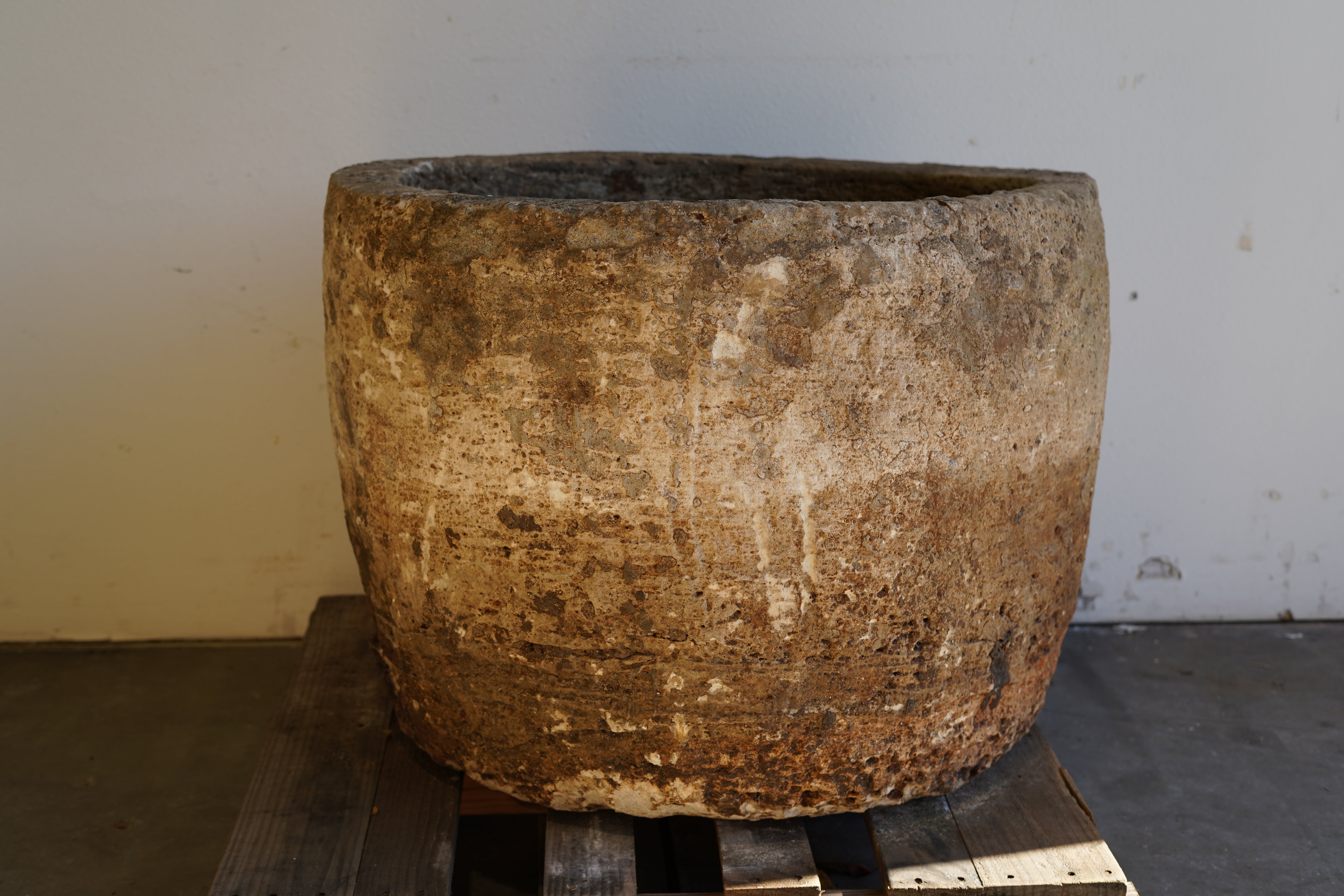 Straight on view of vintage Authentic Limestone Round Planter 28" H x 34" D. 