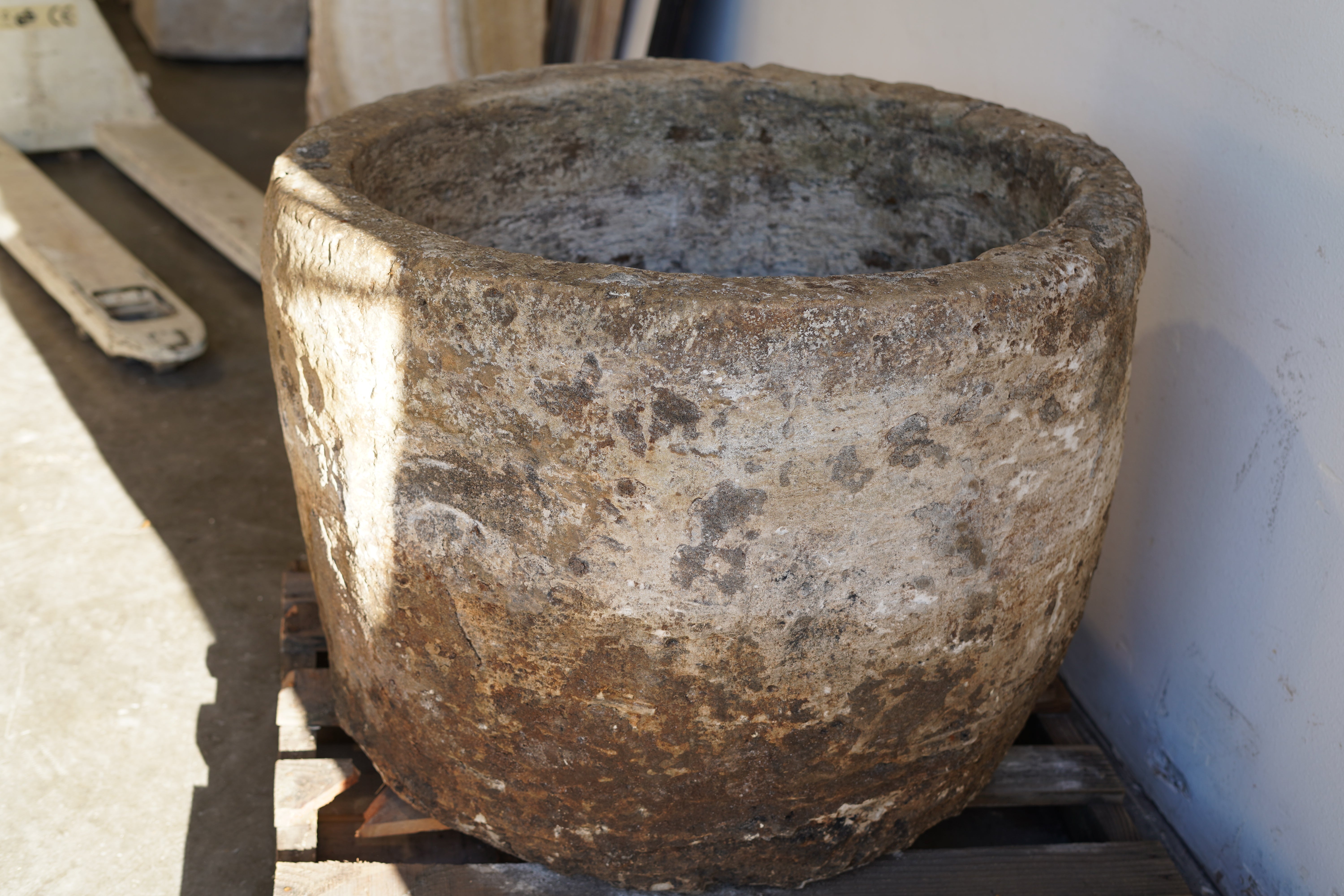 Vintage Authentic Limestone Round Planter 28" H x 34" D. sunlight on left side of planter.
