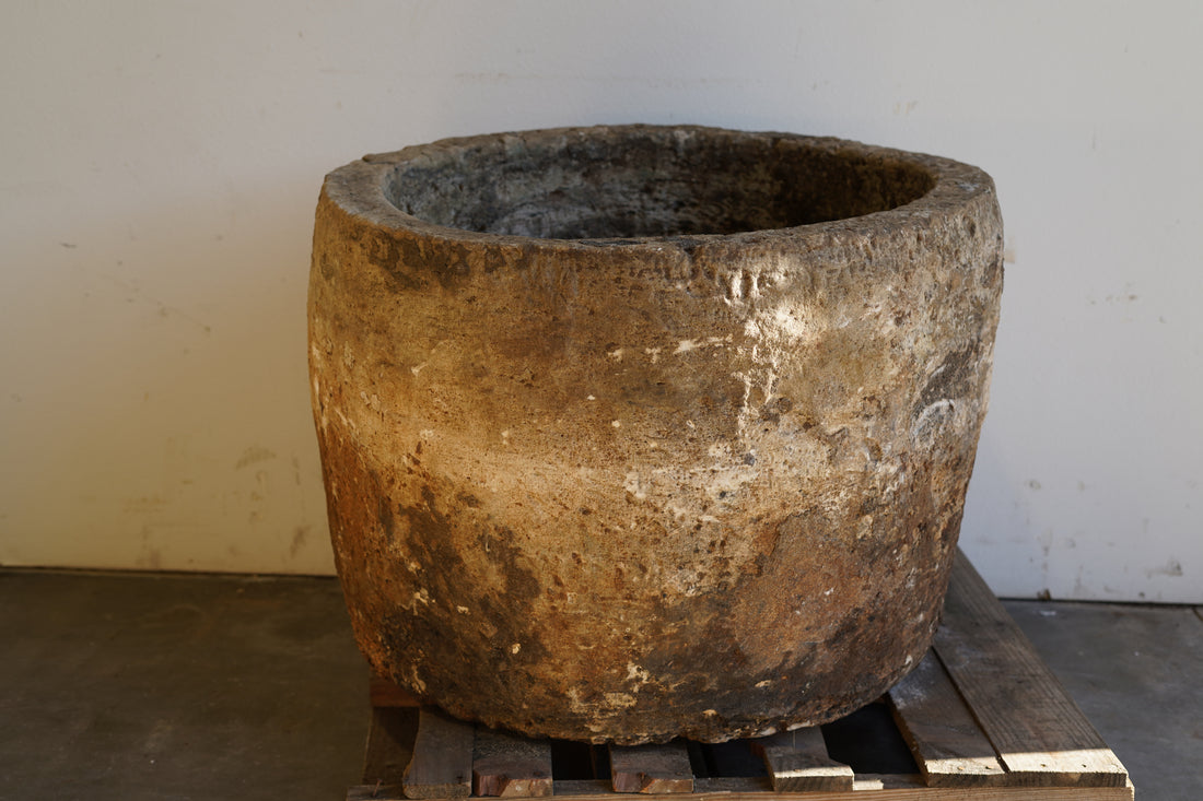 Front view of Vintage Authentic Limestone Round Planter 28" H x 34" D. 
