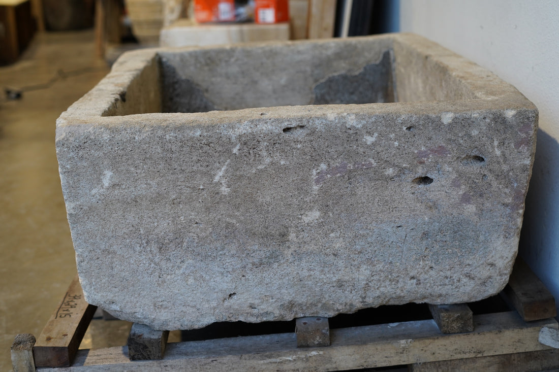 side view of Vintage rectangular limestone trough planter with natural patina, hand-carved and ideal for outdoor gardens or rustic indoor decor, 39L x 29W x 15H inches.