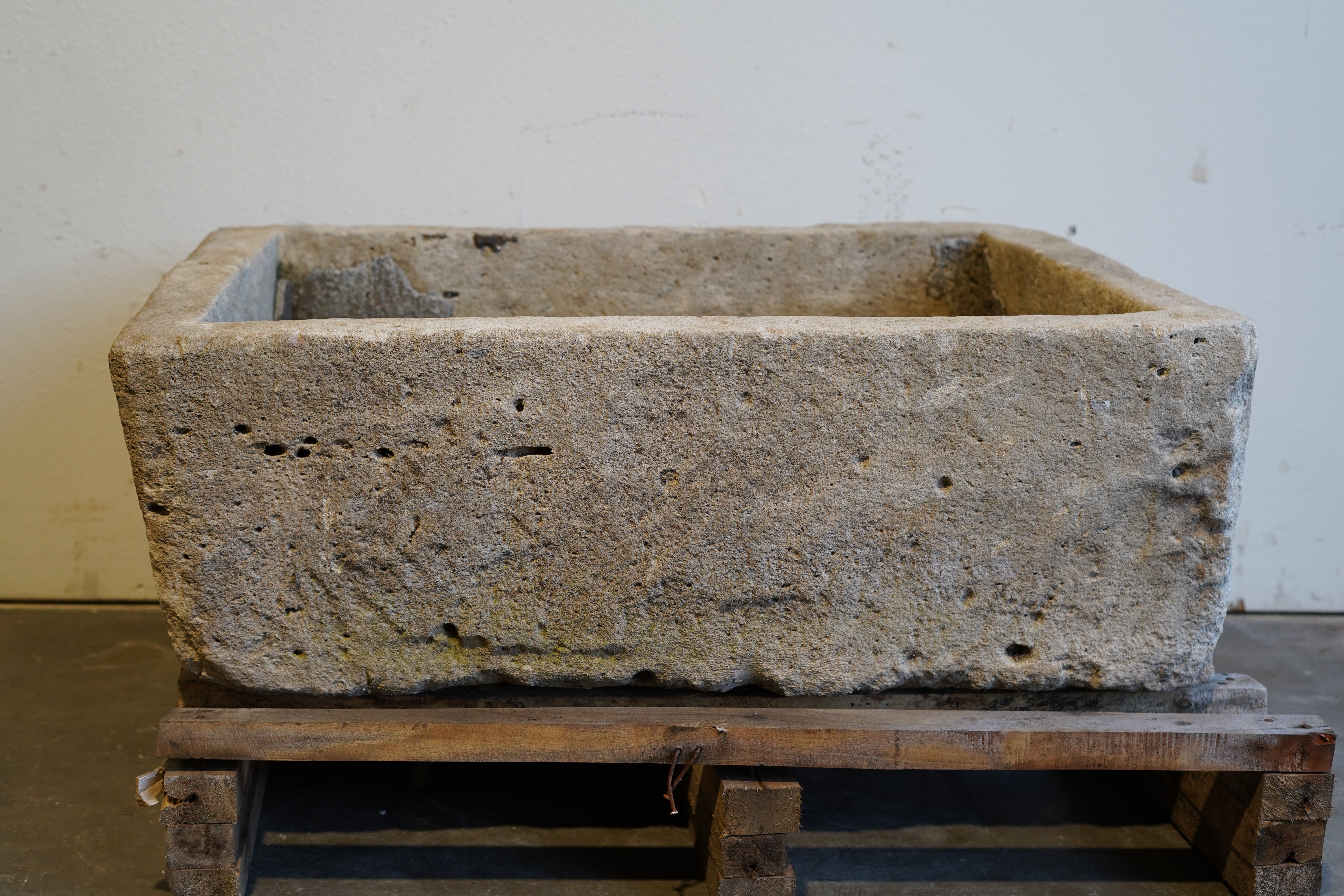 Vintage rectangular limestone trough planter with natural patina, hand-carved and ideal for outdoor gardens or rustic indoor decor, 39L x 29W x 15H inches.