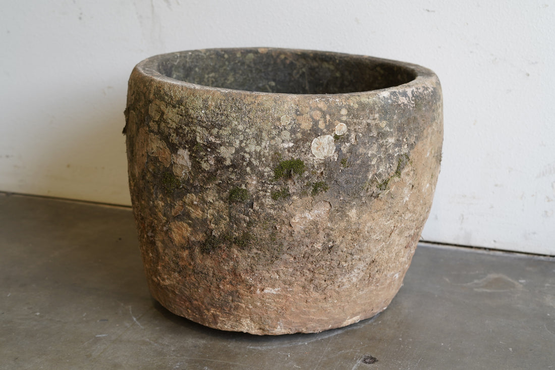 Close up view of patina of Round Vintage, Hand-Carved Limestone Planter with beautiful natural aging and patina.&nbsp;

Dimensions: 24" D x 20" H
